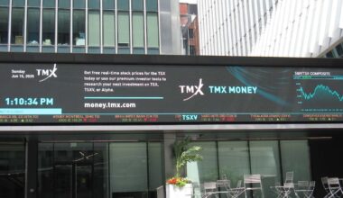 TSX down in late-morning trading, loonie also lower