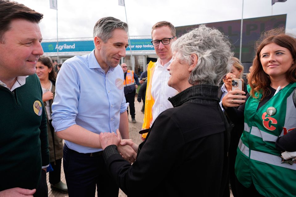 Tánaiste Simon Harris meets Independent Presidential candidate Catherine Connolly at the National Ploughing Championships at Tullamore, Co  Offaly. Pic: Niall Carson/PA Wire