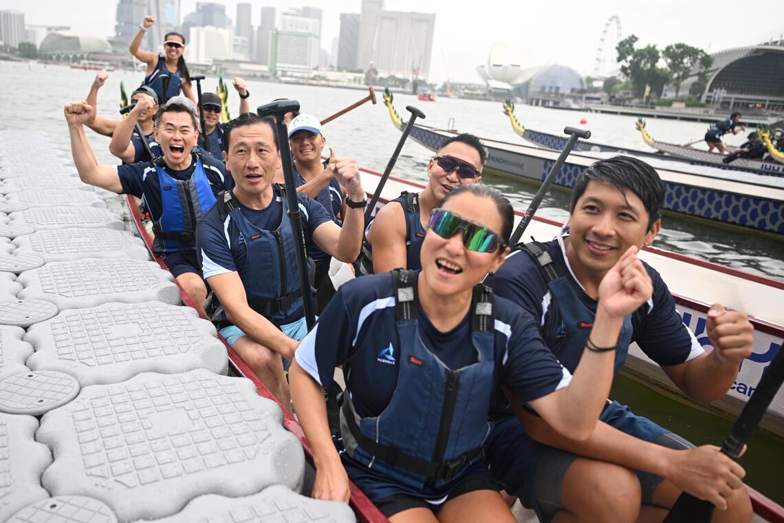 Health Minister Ong Ye Kung (second row, left) paddling in the opening race of the IHH Healthcare x Singapore Sea Regatta on Sept 13.