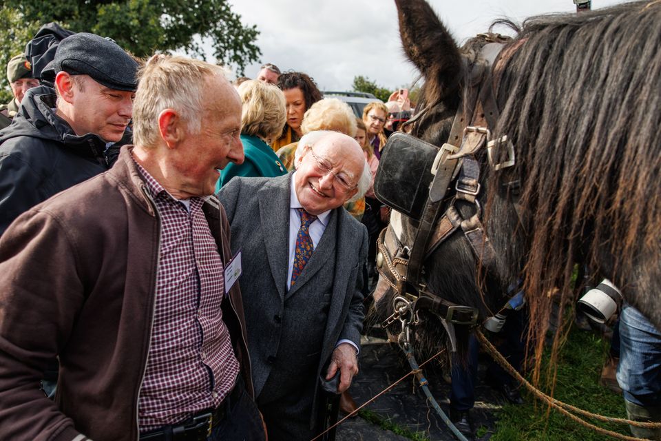 President Michael D Higgins with ploughman JJ Delaney from Macroom in Cork on the first day of the National Ploughing Championships in Screggan, Tullamore, Co. Offaly.
Pic: Mark Condren