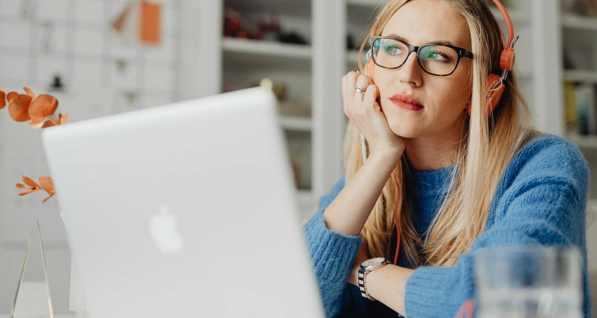 Woman sitting at laptop perplexed