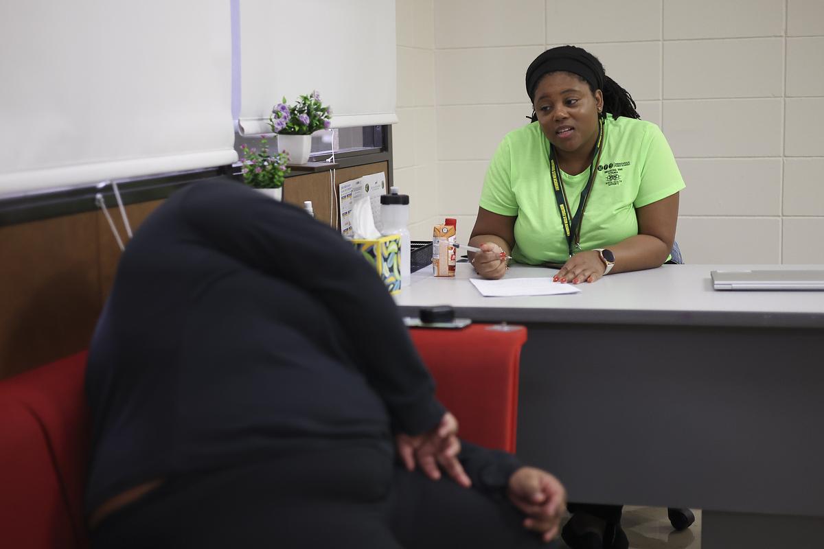 Yolonda Rogers, a mental health specialist, counsels a senior on her plan to seek support throughout the school year at Heritage Academy on Monday, Sept. 15, 2025, in Minneapolis, Minn. Rogers, who is from Minnesota and attended Minneapolis Public Schools, works with students in six schools within the city.