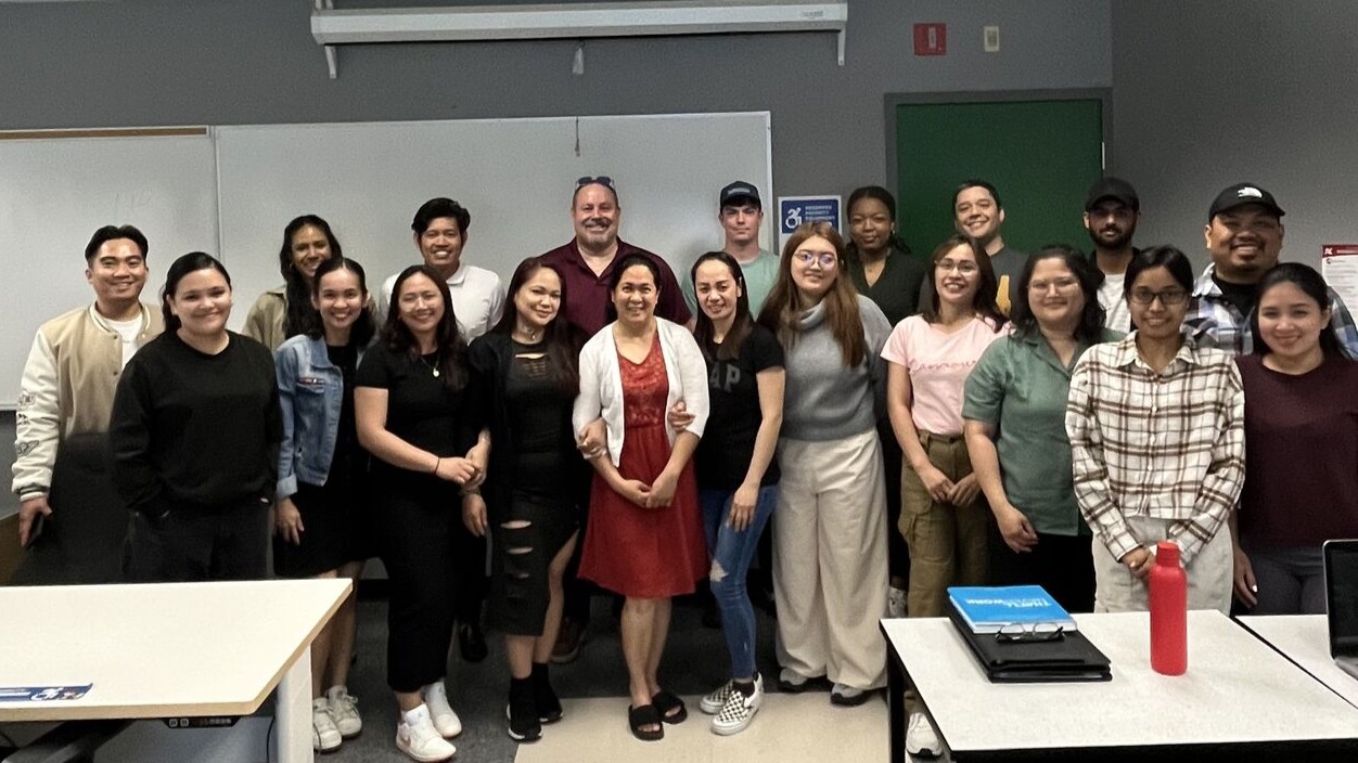 Ottawa business leader Denis Staples (back row, centre left) is taking on the role of