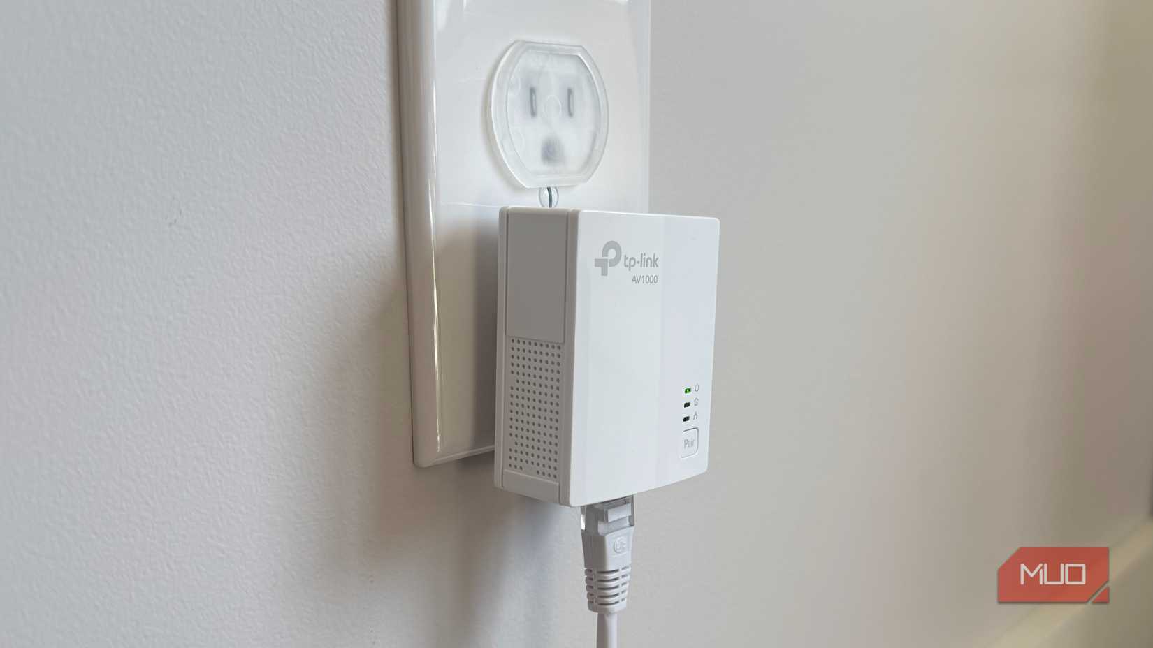 powerline adapter in bedroom plugged into wall socket