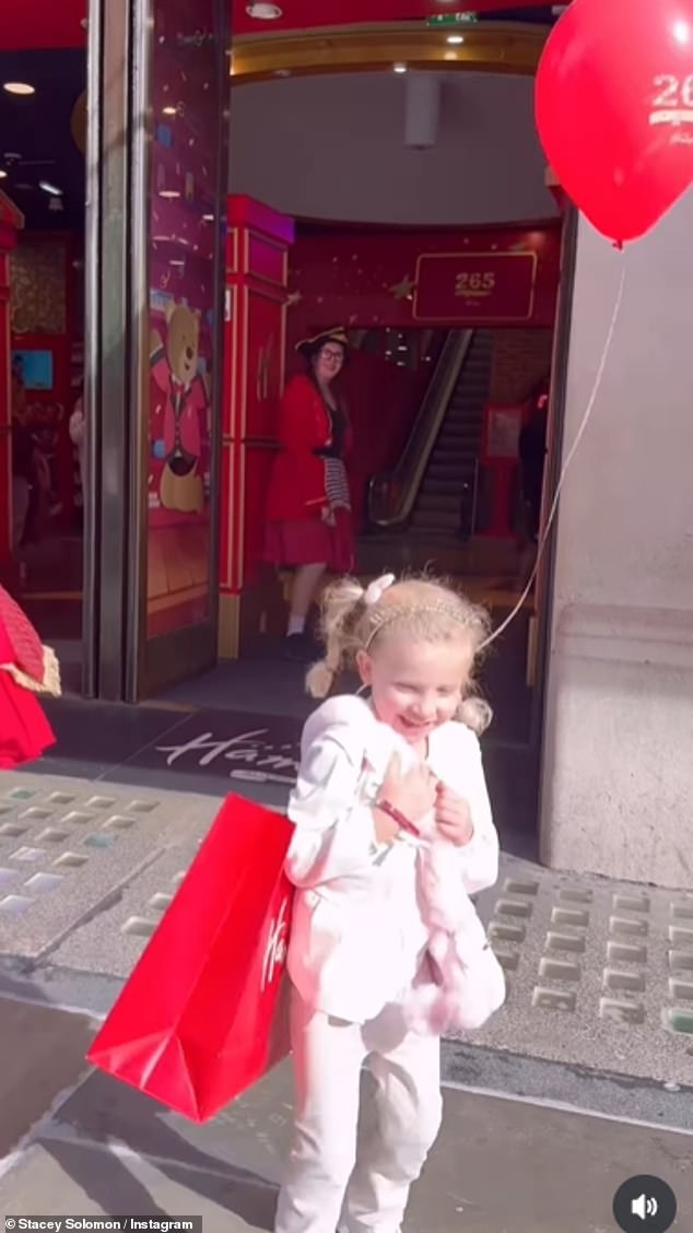 Rose looked thrilled as she skipped out of the toy store carrying a large bag and a balloon