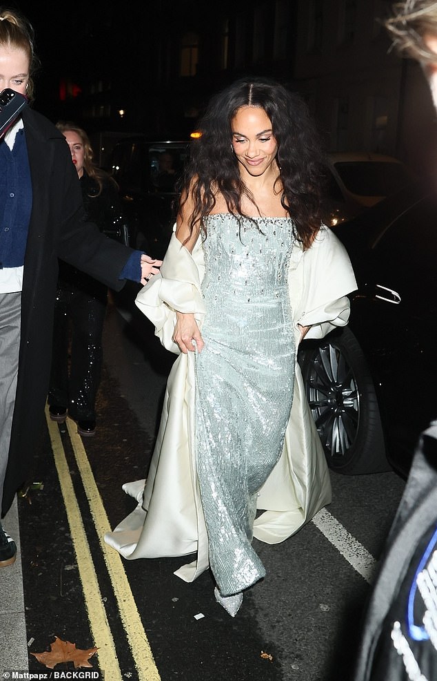 She wrapped up in a huge white silk coat