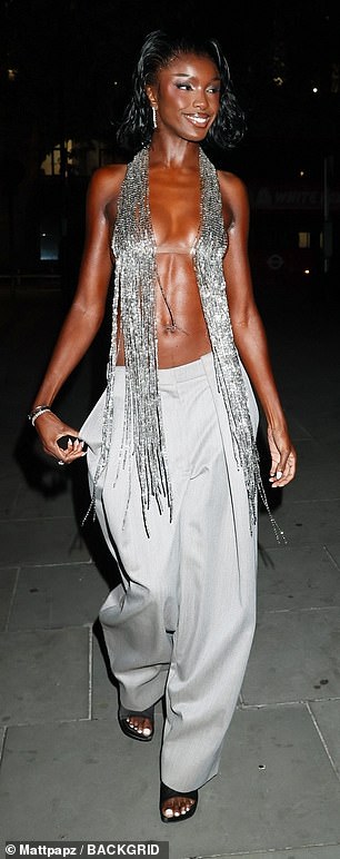 Leomie Anderson looked sensational as she left little to the imagination in a barely there tasseled silver top