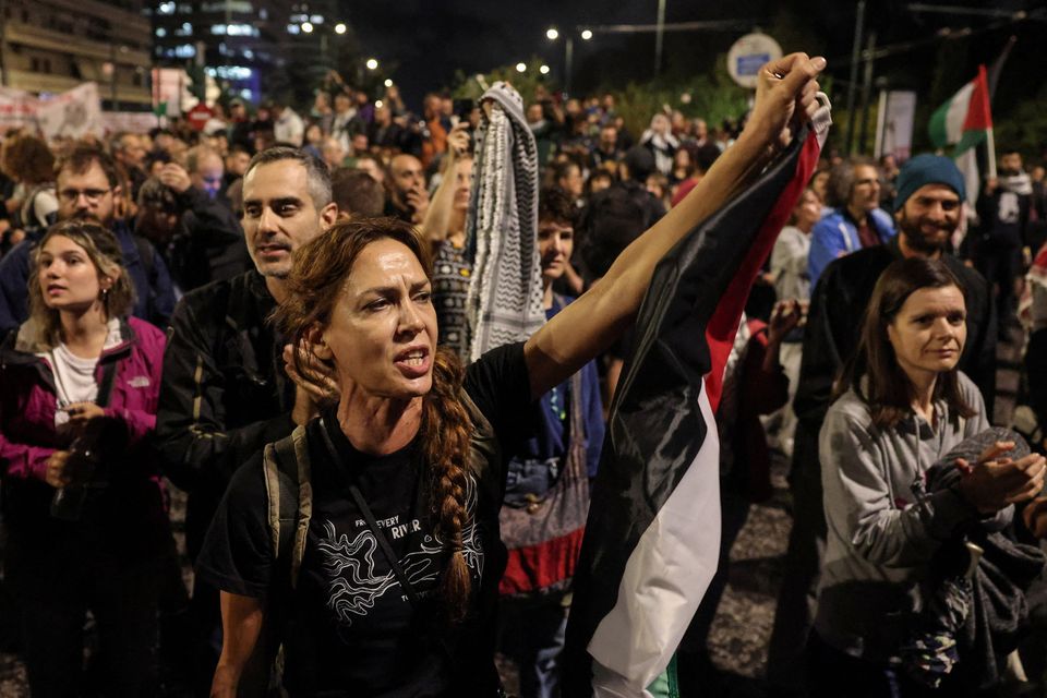 Protesters shout during a demonstration, after Israel intercepted some of the vessels of the Global Sumud Flotilla aiming to reach Gaza and break Israel's naval blockade, near the Israeli embassy in Athens, Greece, October 2, 2025. REUTERS/Louisa Gouliamaki