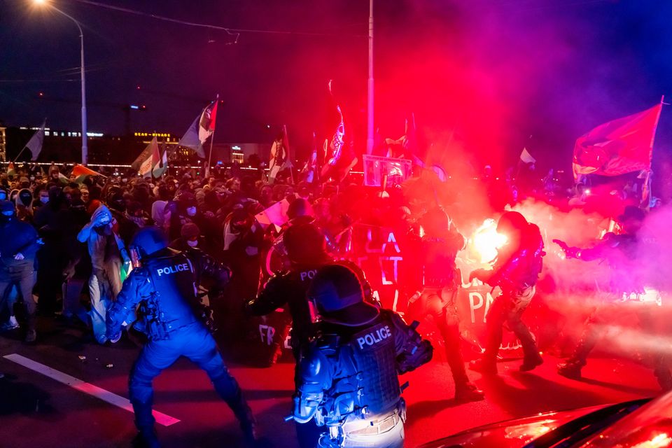 Police officers work during the protest in Geneva, Switzerland, on Thursday, October 2, 2025, in solidarity with the Global Sumud Flotilla after ships were intercepted by the Israeli navy. (Magali Girardin/Keystone via AP)