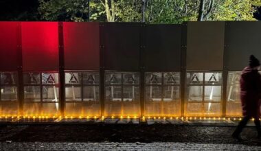 Protesters let off pink smoke outside hotel housing asylum seekers in Citywest