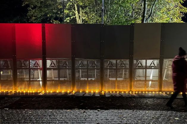 Protesters let off pink smoke outside hotel housing asylum seekers in Citywest