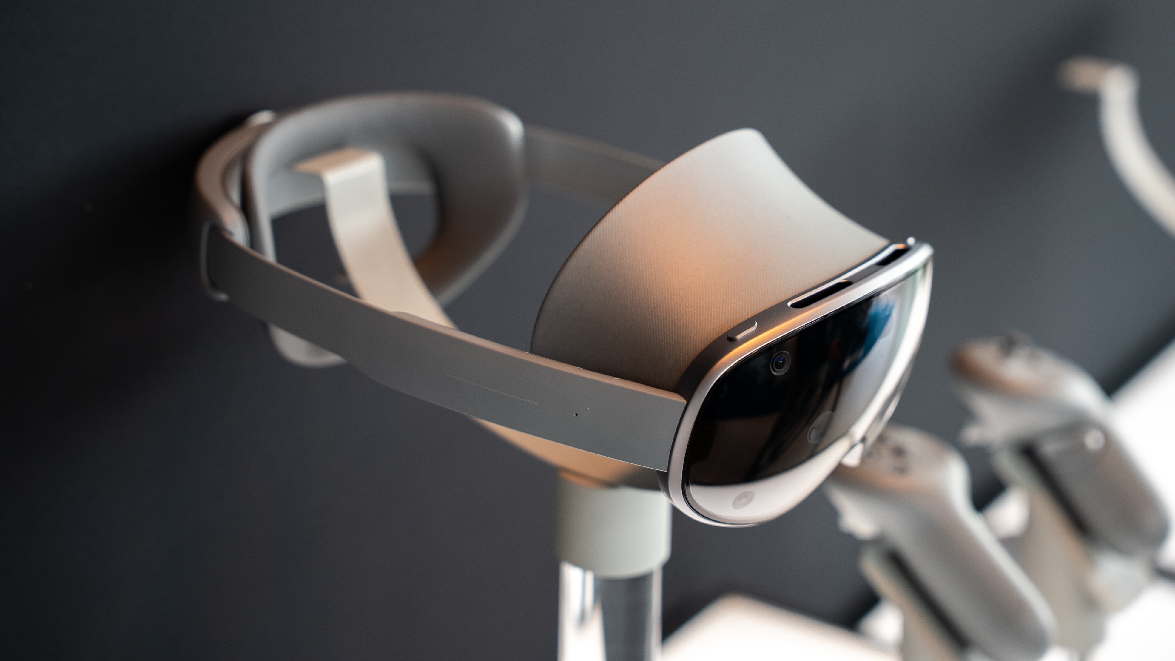 A photo of Samsung Galaxy XR sitting on a pedestal from a top-down, right-side angle.