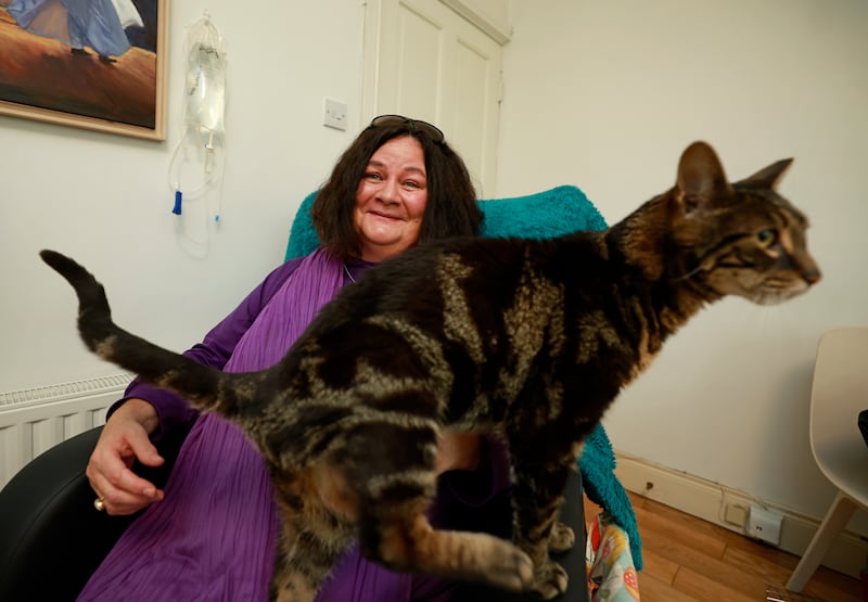 Mim Greene and her cat Kismet at home in Dublin. Photograph: Nick Bradshaw/The Irish Times
