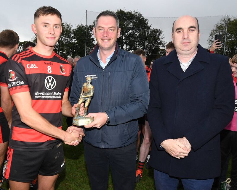 Hugh O'Connor (Newmarket) receives the Duhallow JAHC Man of the Match from Connie Tarrant in the presence of Steven Lynch, chairman, Duhallow Junior Board. Picture: John Tarrant  Hugh O'Connor (Newmarket) receives the Duhallow JAHC Man of the Match from Connie Tarrant in the presence of Steven Lynch, chairman, Duhallow Junior Board. Picture: John Tarrant