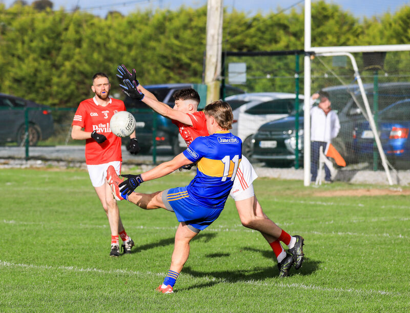 Ballygarvan's Stephen Fenton blocks a shot at goal by Carrigaline's Jack McGrath. Picture: David Creedon