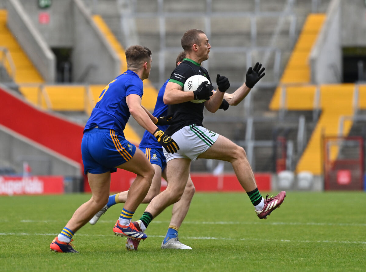  Conor Horgan of Nemo Rangers is tackled by St Finbarr's players Dylan Quinn and Sam Ryan. Picture Dan Linehan
