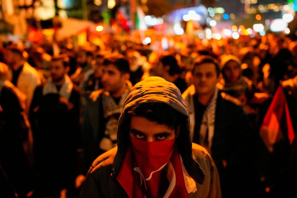 People gather in front of the Israel consulate during a protest against the interception of the Gaza-bound Sumud flotilla by Israeli navy forces, in Istanbul, Thursday, Oct. 2, 2025. (AP Photo/Emrah Gurel)