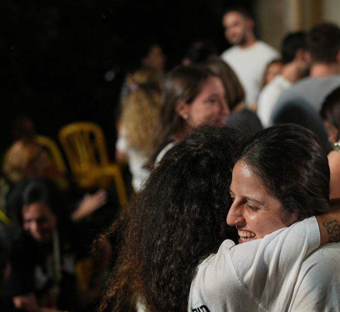 Relatives and supporters of Israeli hostages held by Hamas in the Gaza Strip celebrate after the announcement that Israel and Hamas have agreed to the first phase of a peace plan (Emilio Morenatti/AP)
