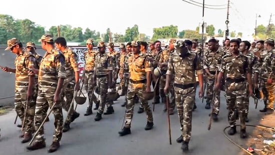 Security personnel walk past during a route march on the eve of the Dussehra festival, in Bareilly, Uttar Pradesh, Wednesday, Oct. 1, 2025.(PTI)