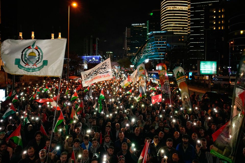 People gather in front of the Israel consulate during a protest against the interception of the Gaza-bound Sumud flotilla by Israeli navy forces, in Istanbul, Thursday, Oct. 2, 2025. (AP Photo/Emrah Gurel)