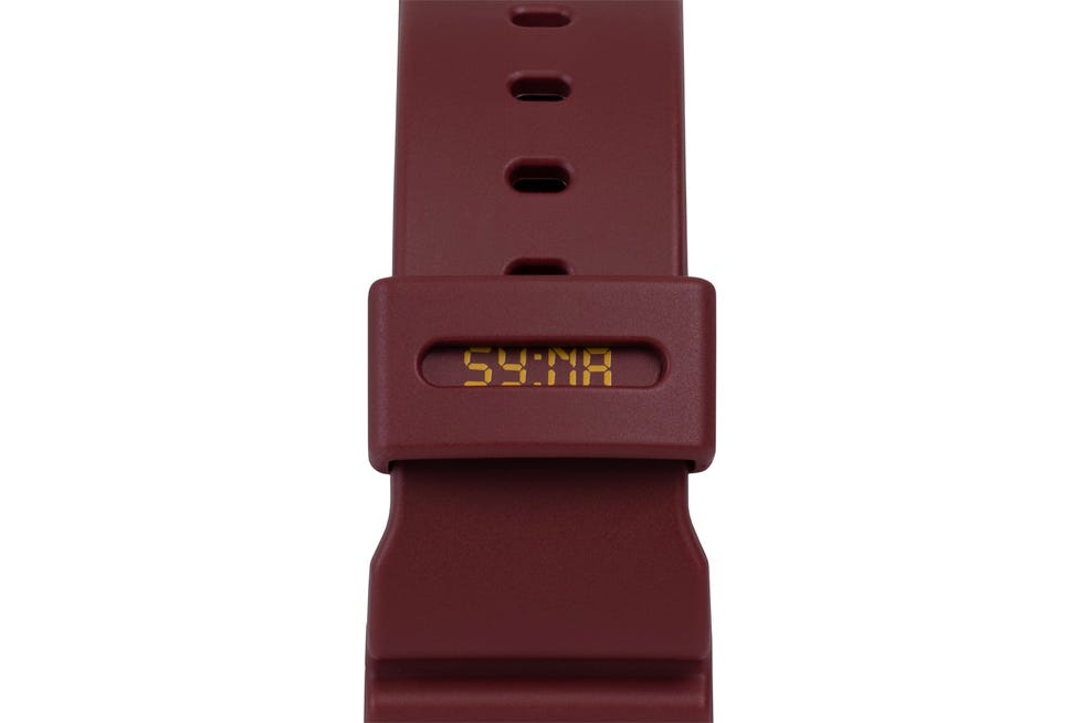 digital watch with a maroon strap displaying time