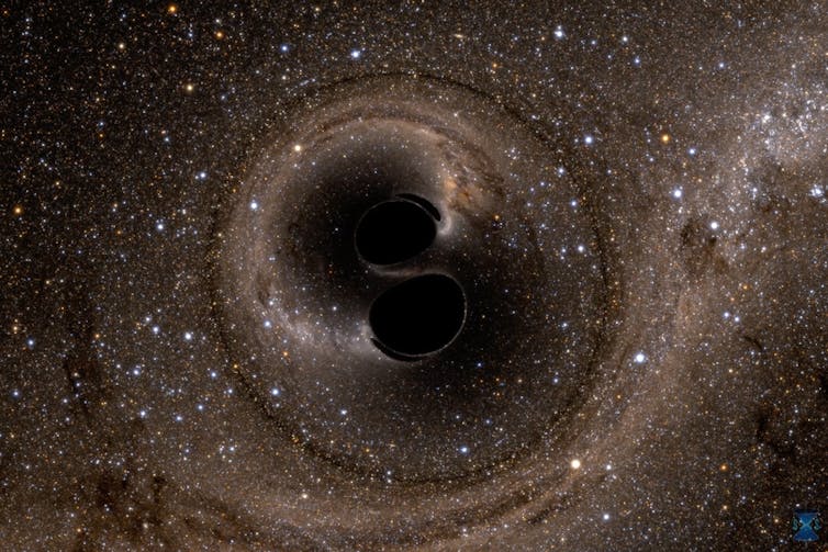 An illustration of two black circles merging in space