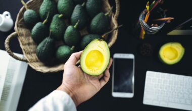 On the desk Table top, smart phone, avocado