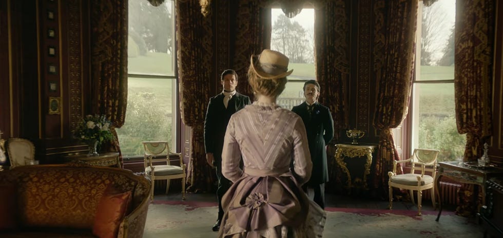 james norton and anthony boyle as rafferty standing in front of olivia played by danielle galligan in house of guinness jpg