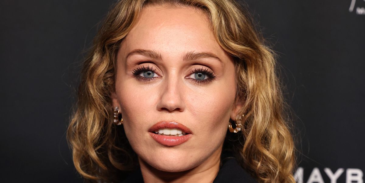 Miley Cyrus Wears a Plunging Power Suit for a Maybelline Launch