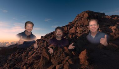 CNET's Scott Stein as a virtual Persona avatar in Apple's Vision OS, hovering in a volcanic canyon with Apple's Jeff Norris and Steve Sinclair.