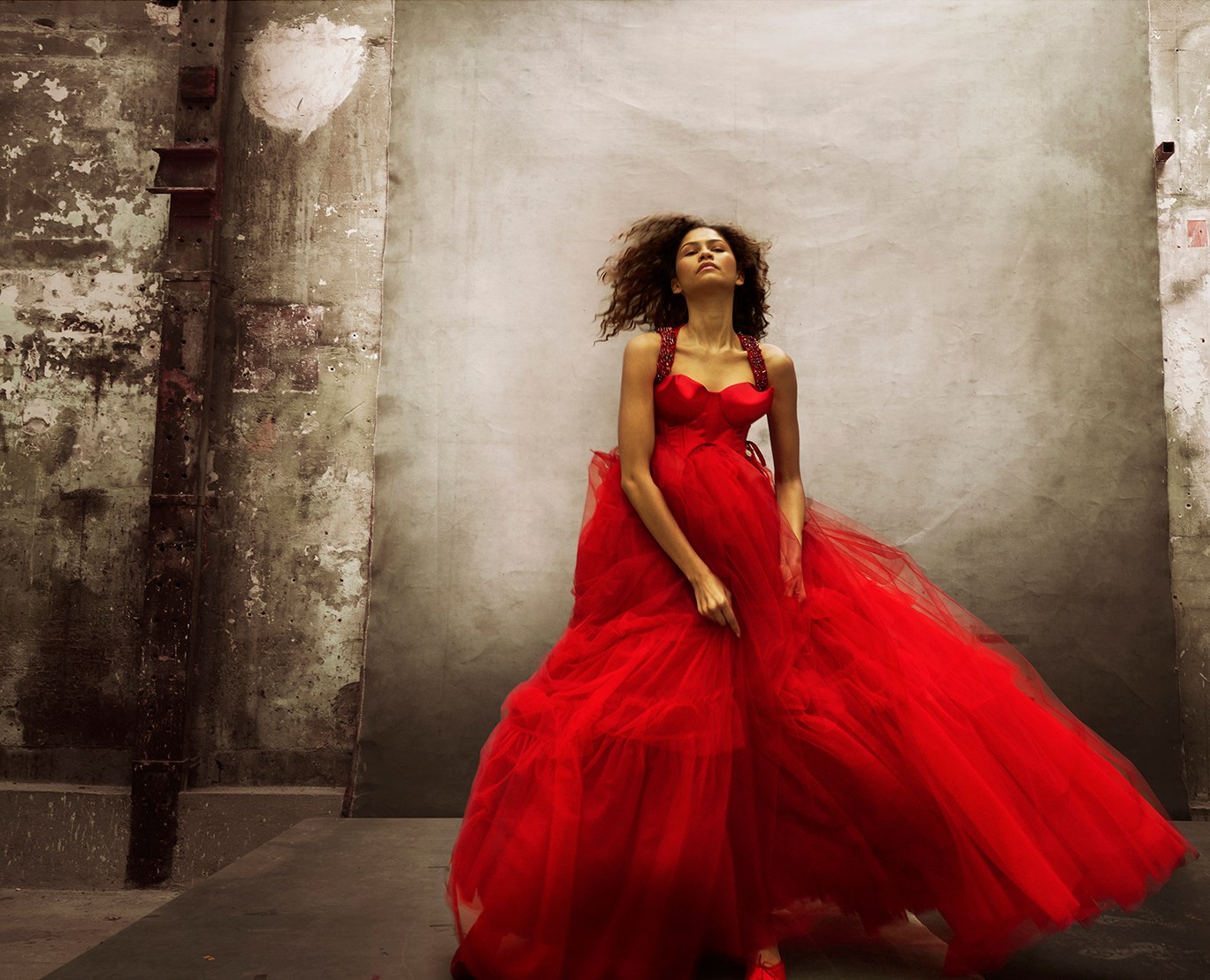Zendaya in a flowing red gown.