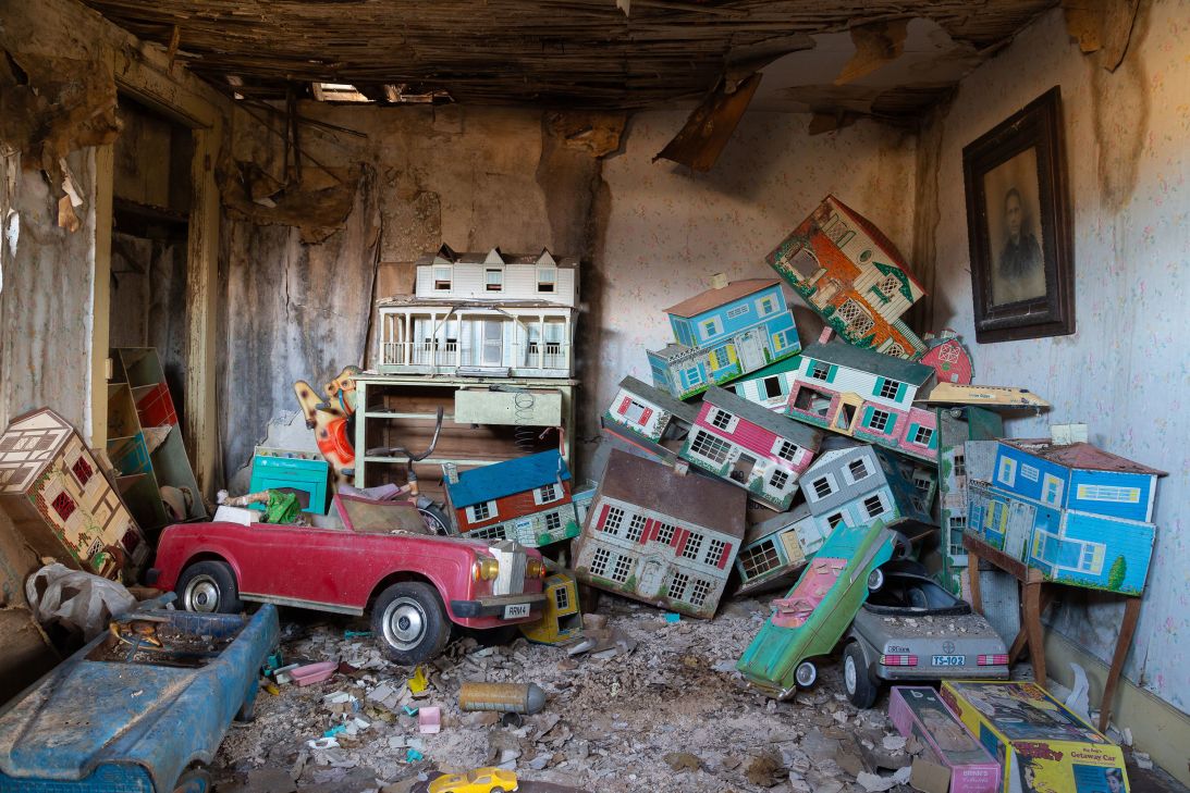 In one property, old dollhouses lie in eerie decay.
