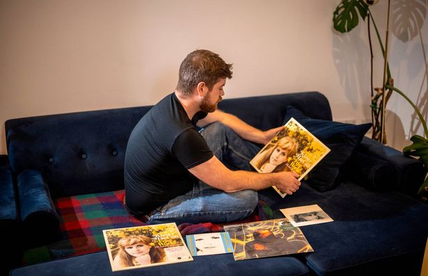 For the Express.    Feature on former singer Kirsty Mac Coll, on the 25th anniversary of her death  in a speed boat accident  in Mexico .  Pictured is her  son Louis in his home .
And some of him outside the family home he grew up in with his mother. ( there is a green plaque on the wall also.
PICTURE  BY HUMPHREY NEMAR’.           14/11/2025 .