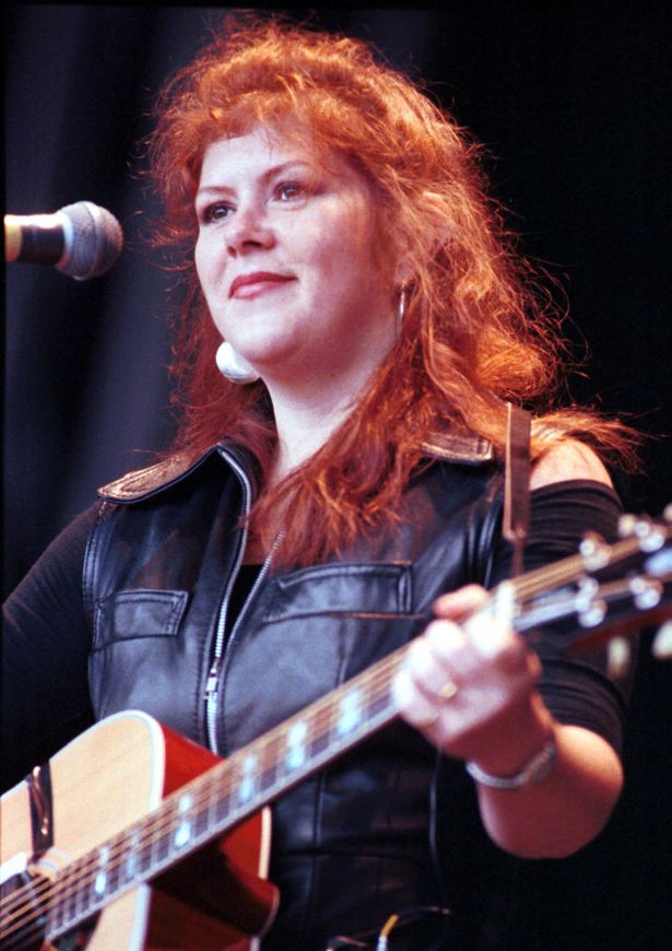 Kirsty MacColl performing on stage 1995