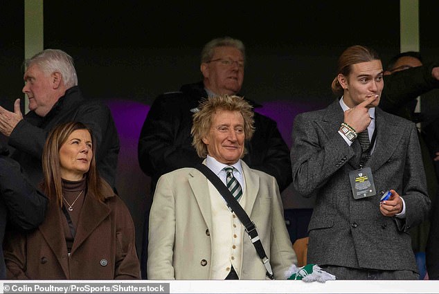 The father-and-son duo - who share a known passion for football - looked in high spirits as they cheered on Celtic FC, their favourite team