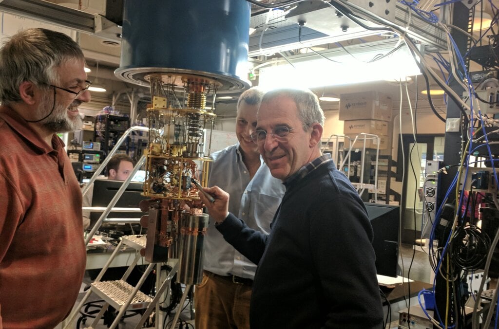 Men in front of quantum computer