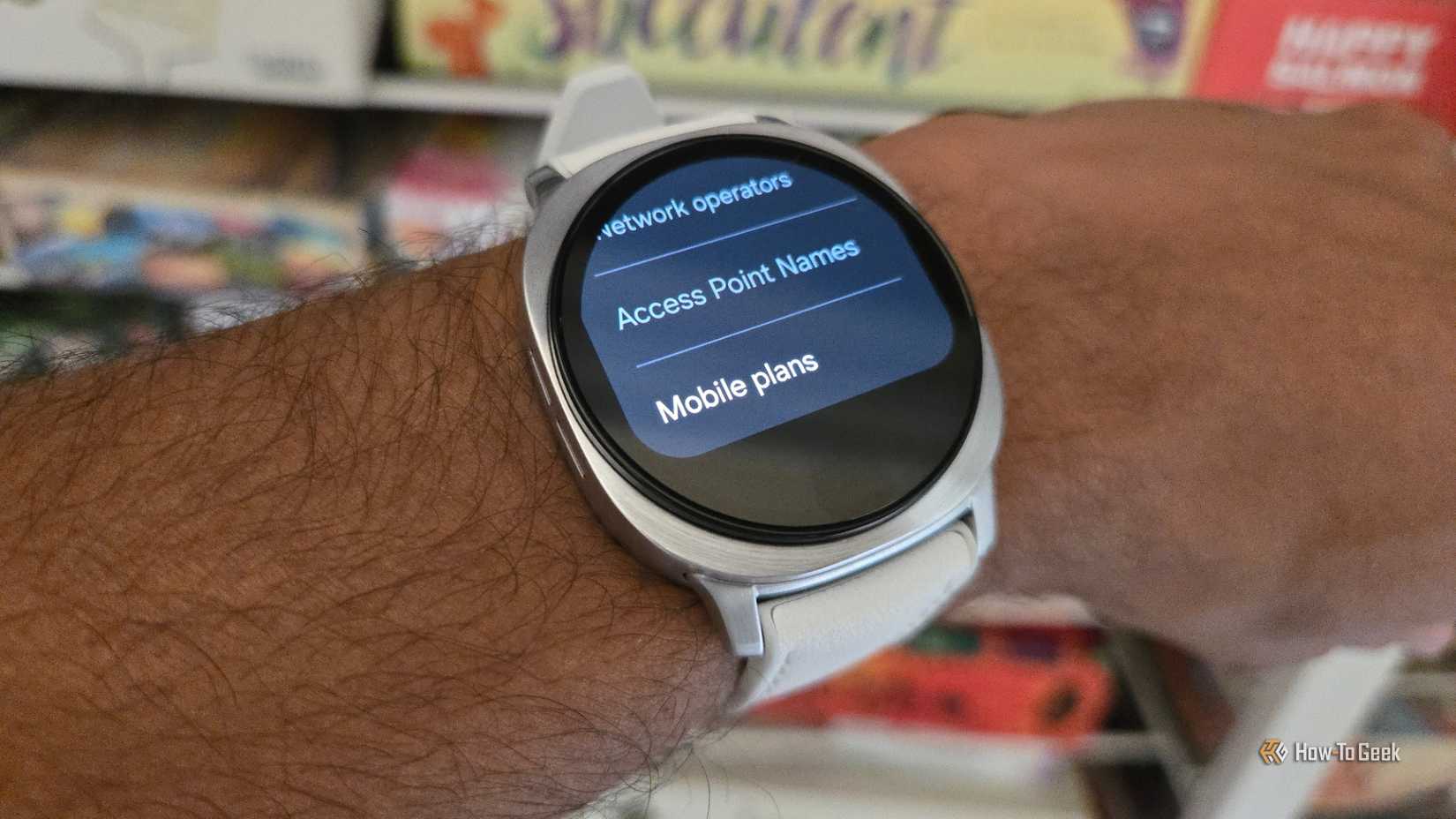 A Samsung Galaxy Watch 8 with mobile plan settings open.