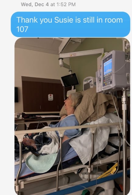 Susie Silvestri is sleeping on bed in the Moose Jaw hospital, surrounded by medical equipment. 