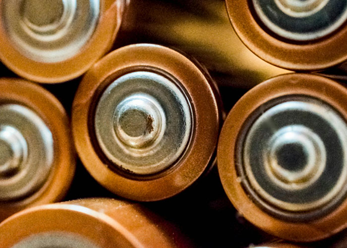 Close-up of worn batteries symbolizing energy in psychiatric institution workers' unforgettable on-the-job experiences.