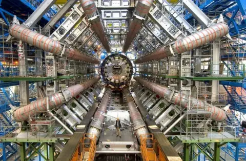 Cern Lots of tubes and metal parts making up part of the Large Hadron Collider.
