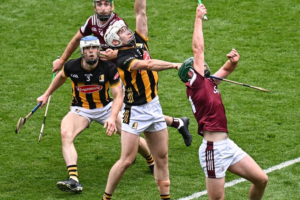 Mikey Carey of Kilkenny wins possession ahead of Cathal Mannion of Galway=