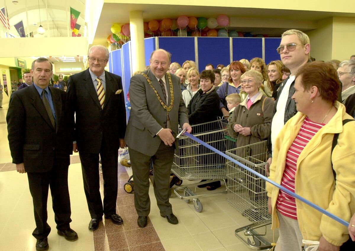 The Lord Mayor of Cork Cllr PJ Hourican cutting the tape to officially open the new Dunnes Stores in Blackpool Shopping Centre in 2000, watched by Joe Gavin, Cork City manager and the late Clayton Love jnr, developer. Picture: Richard Mills.