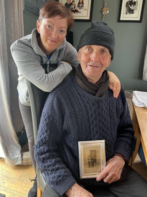 Paddy McCarthy pictured with his daughter Mary. Paddy is holding a photograph of his father Jeremiah with Philomena.	Picture: Aisling Meath
                    