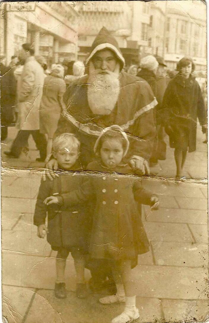 Jim Sheils and Sheila Maguire with Santa on Patrick Street.