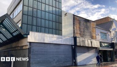 Family having a moment together messing about while winter sea swimming