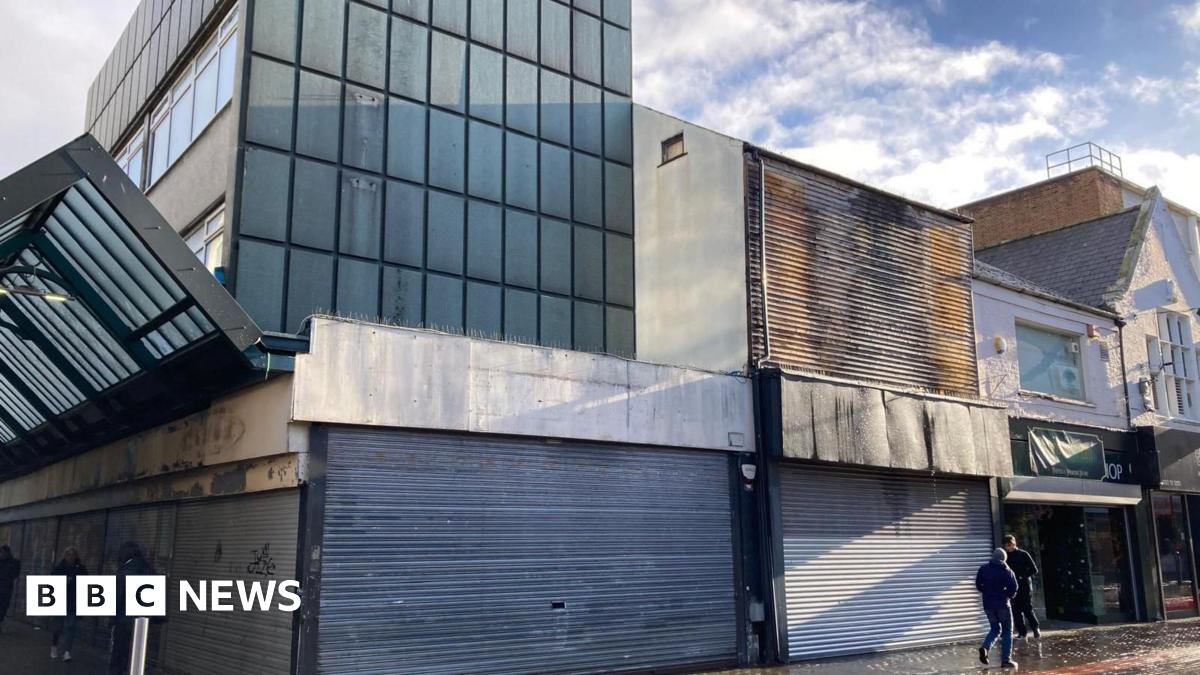 Family having a moment together messing about while winter sea swimming