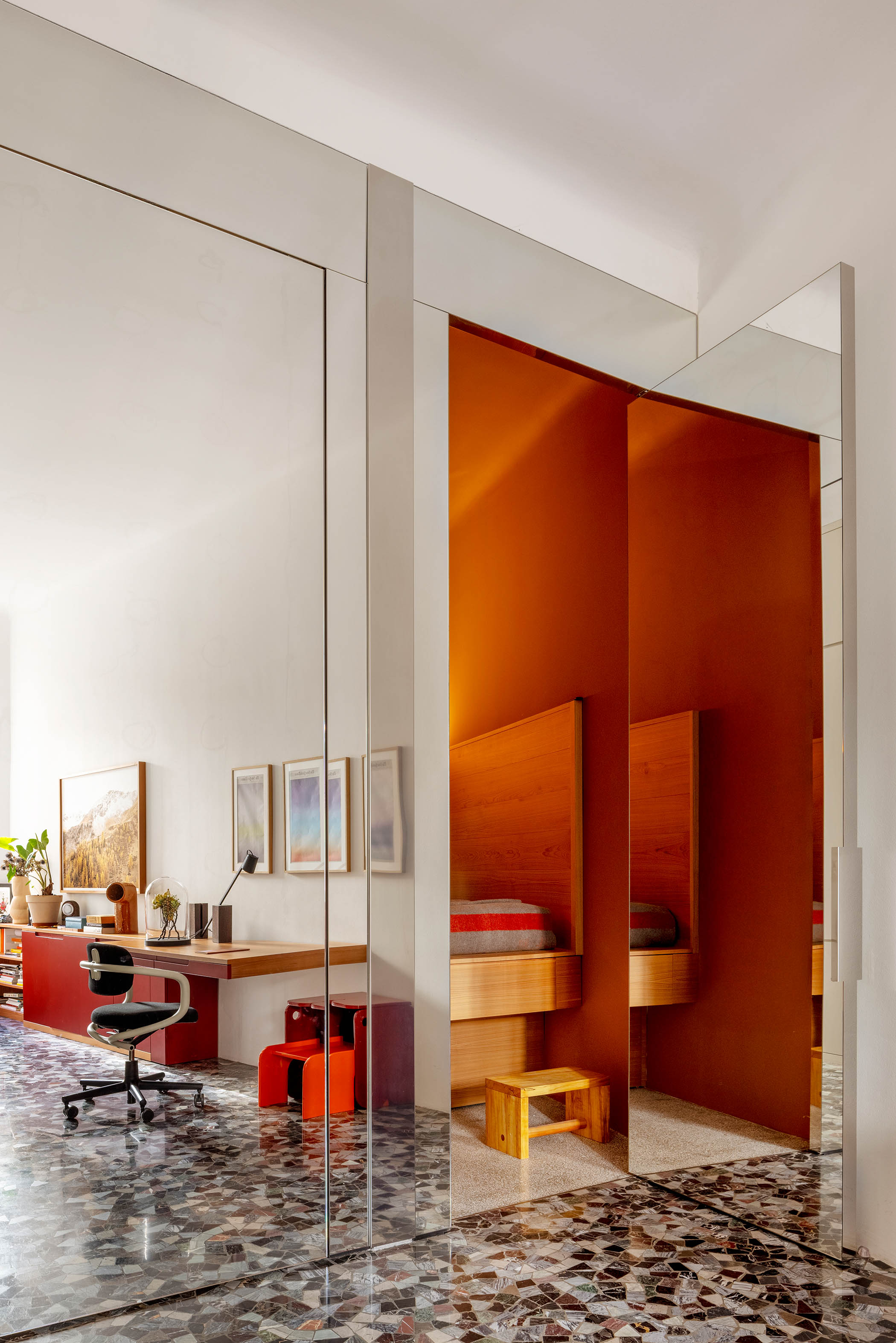 Mirrored walls and original flooring in the hallway