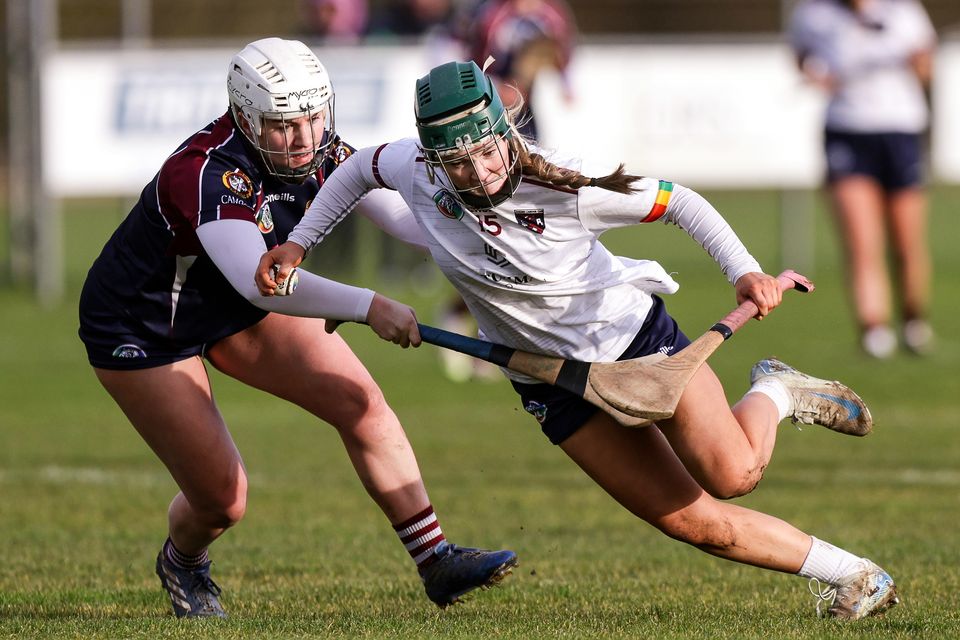 Athenry's Clodagh Burke is tackled by Dicksboro's Jane Cass during the All-Ireland Senior Club Camogie Championship semi-final at Coralstown, Kinnegad. Photo: Inpho/John McVitty