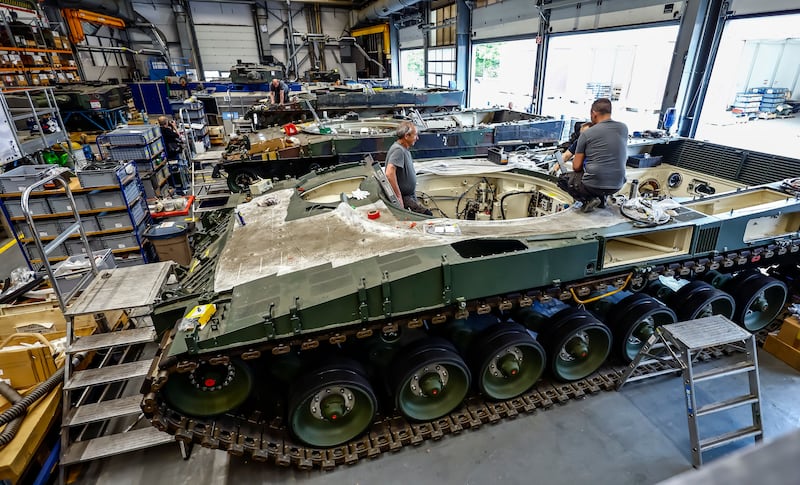 Rheinmetall staff work on the refurbishment of a German battle tank Leopard in Unterluess, Germany. Photograph: Hannibal Hanschke/EPA