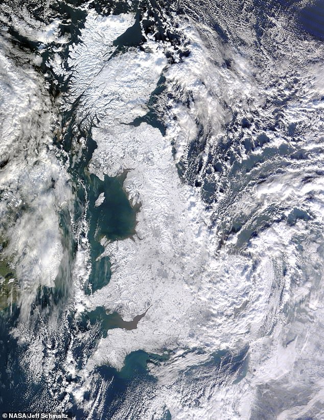Blanketed with snow: This satellite picture shows the extent of snow cover across Britain and Ireland on January 7, 2010. Under the modelling scenario, scenes like this could be much more common